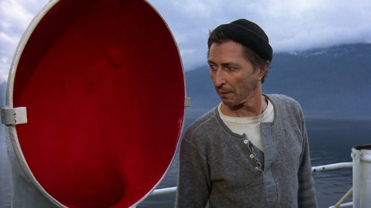 Friday the 13th Part VIII: Jason Takes Manhattan (1989) movie still: medium — A man stands on a boat deck with a large red circular metal component.