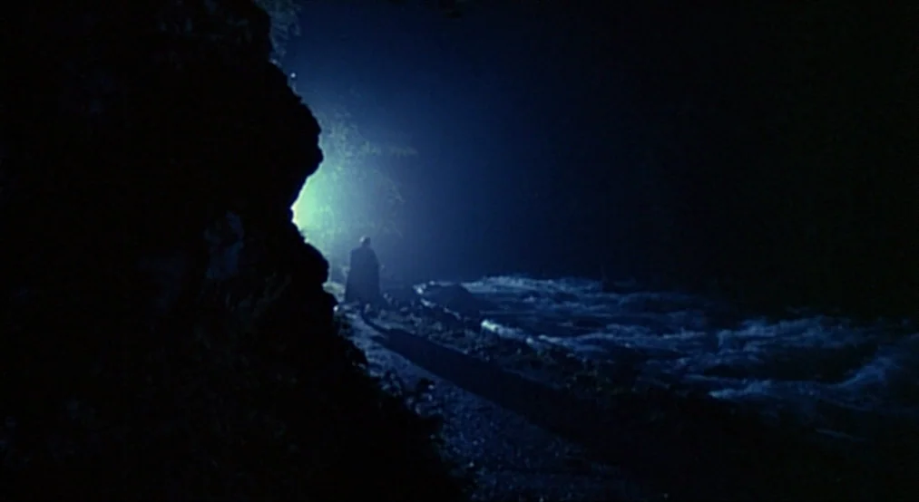 Nosferatu the Vampyre (Nosferatu Phantom Der Nacht) (1979) movie still: wide — A dark riverbank path stretches alongside a fast-moving, white-capped…