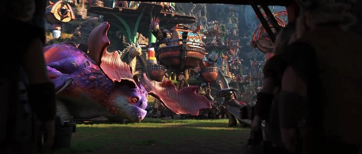 How to Train Your Dragon: The Hidden World (2019) movie still: wide — A bustling fantasy village built into mountain terrain features multi-level…