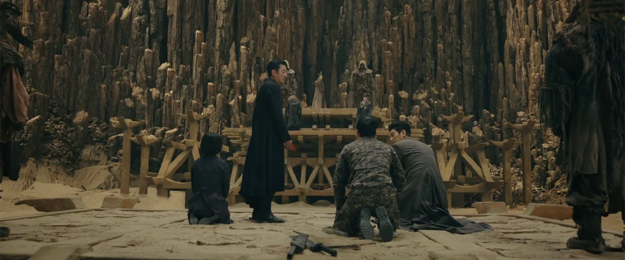 Along with the Gods: The Last 49 Days (2018) movie still: wide — A tall canyon with vertical rock formations surrounds a flat stone base. Three…