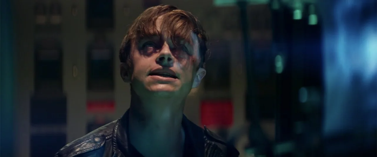 The Amazing Spider-Man 2 (2014) movie still: closeup — A dark, industrial interior contains rows of glowing computer server racks in the background.…