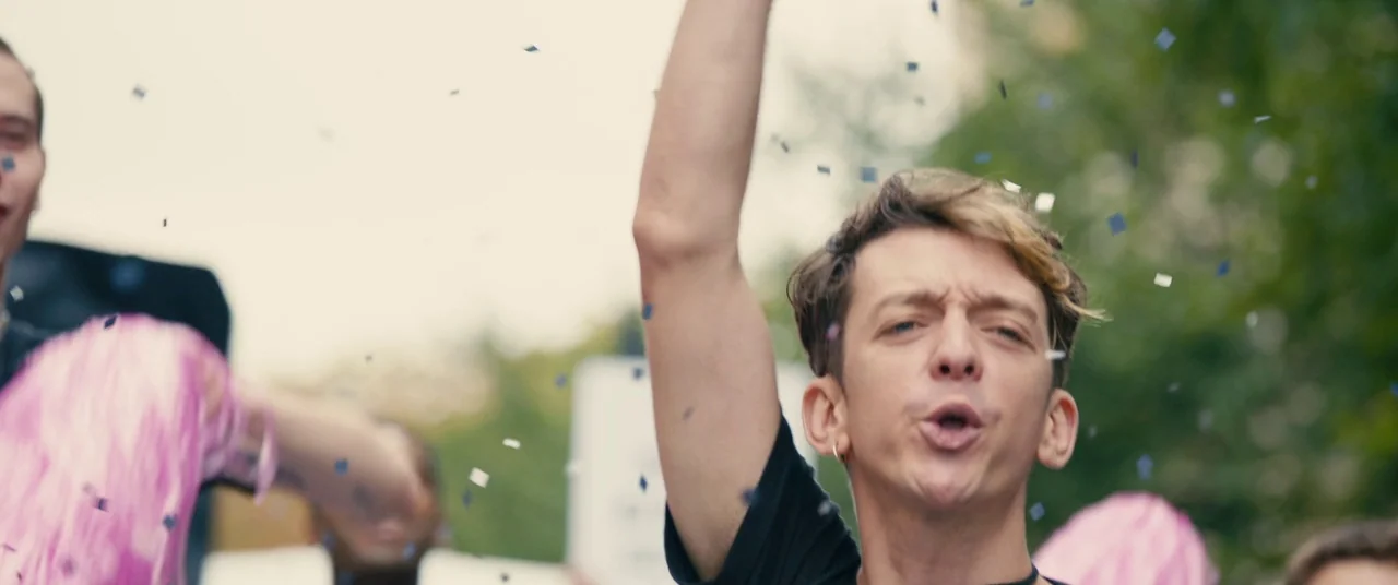 BPM (Beats Per Minute) (2017) movie still: medium — An outdoor festive environment features people participating in a public street parade or…