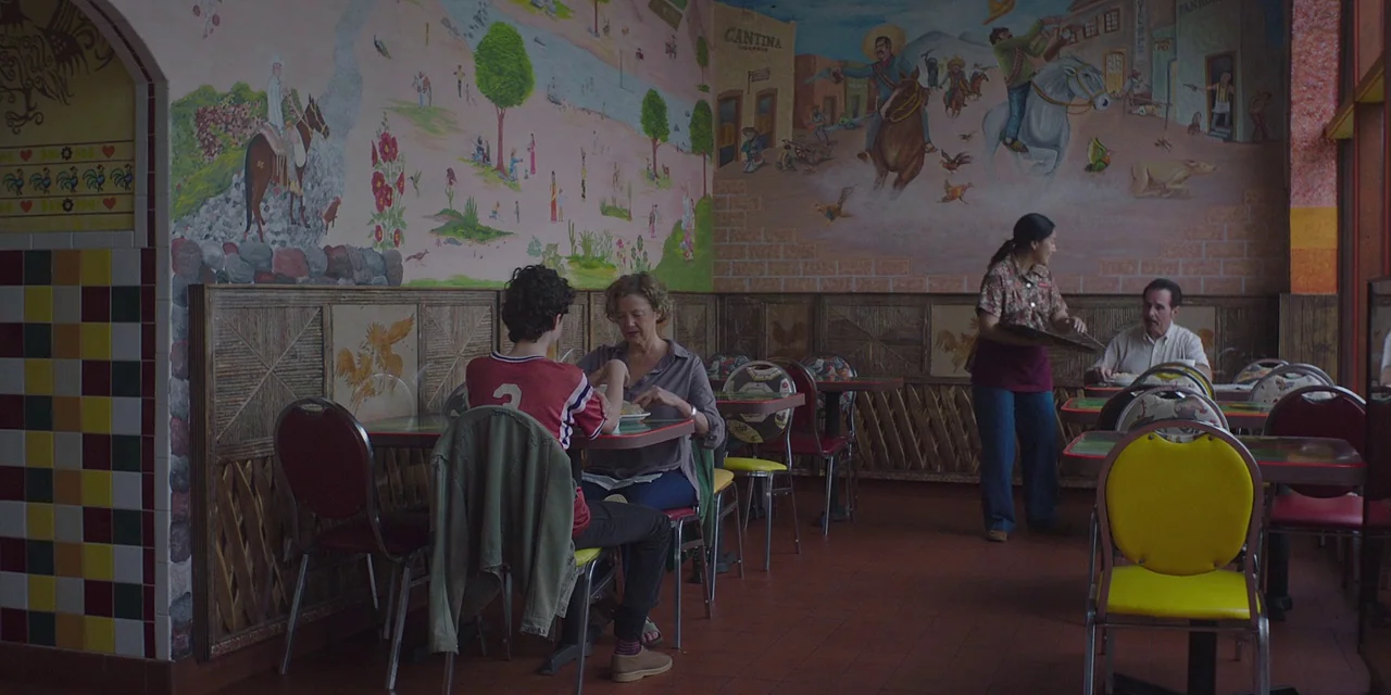 20th Century Women (2016) movie still: wide — A Mexican-themed restaurant features tiled walls and a large, colorful mural depicting desert life. A…