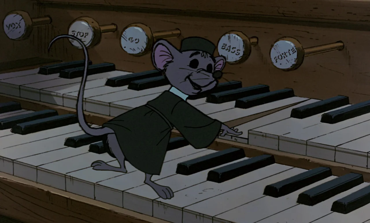 Robin Hood (1973) movie still: medium — An interior shot of a large wooden pipe organ with rounded pull-stops labeled clearly. A small mouse…