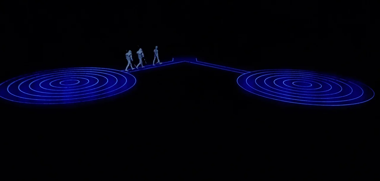Tron (1982) movie still: wide — A vast black void features two glowing blue concentric circular patterns connected by a line. Three white-suited…