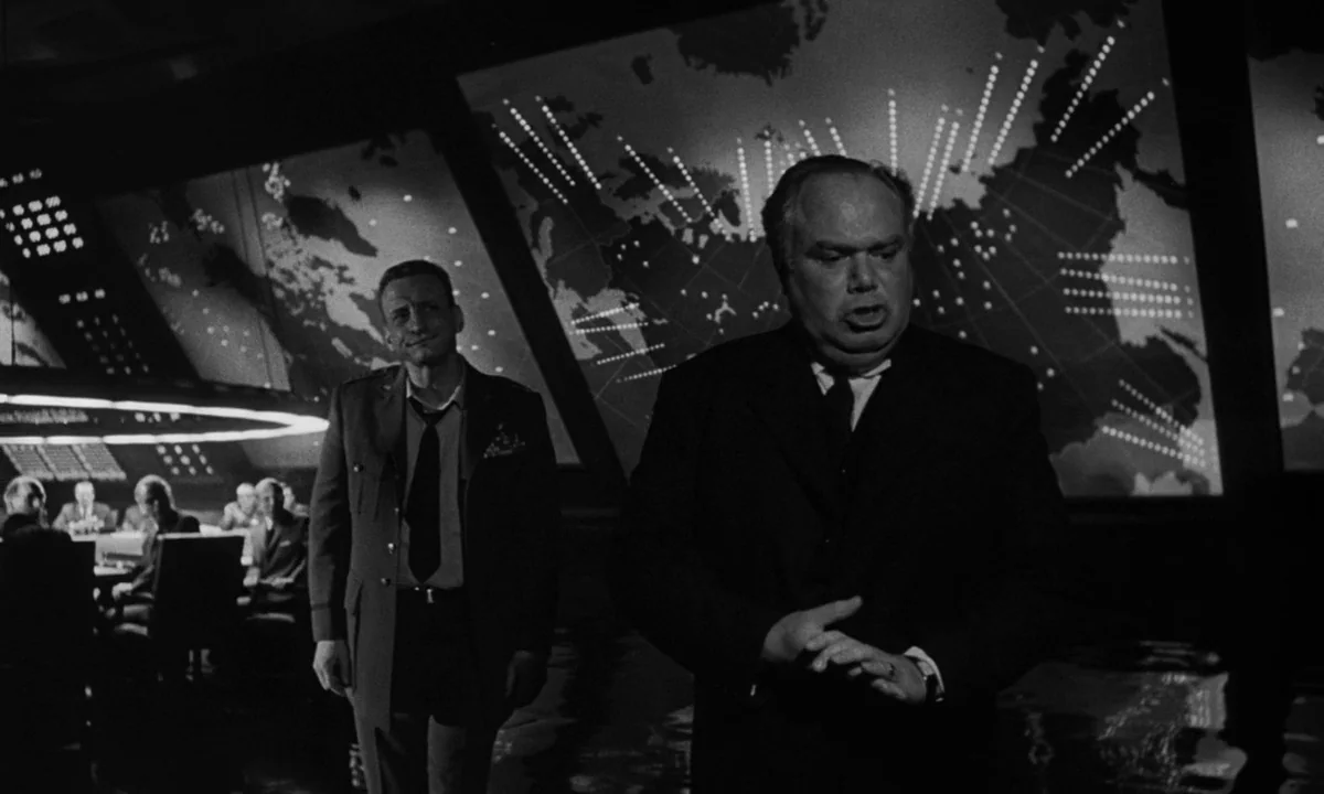 Dr. Strangelove or: How I Learned to Stop Worrying and Love the Bomb (1964) movie still: medium — A dark subterranean command center featuring large…