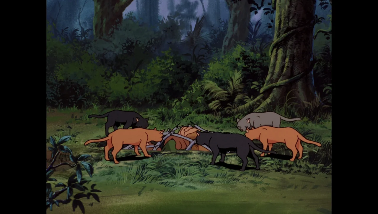 Scooby-Doo on Zombie Island (1998) movie still: medium — Five cats stand in a grassy clearing surrounded by large dark tree trunks. The cats gather…