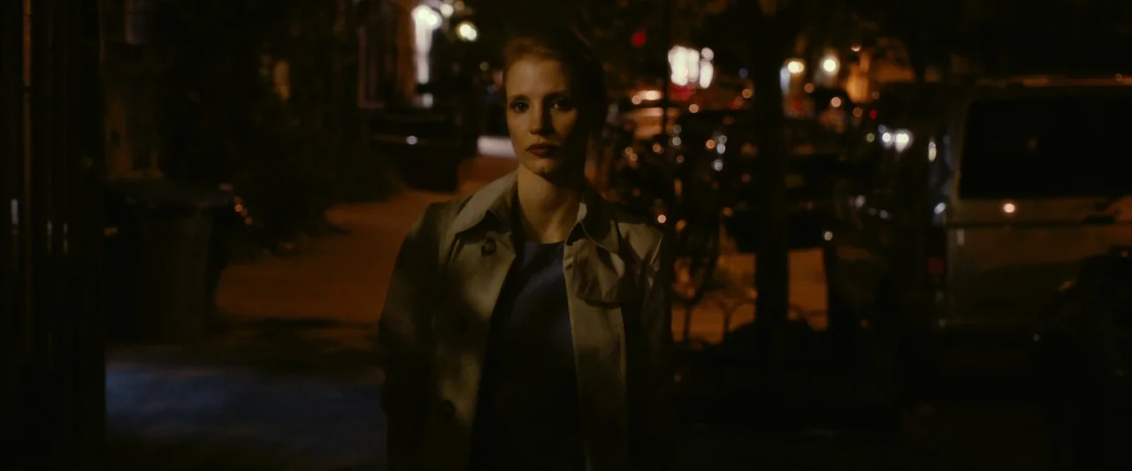 The Disappearance of Eleanor Rigby: Her (2014) movie still: medium — A dark city street at night with out-of-focus parked cars in the background. A…