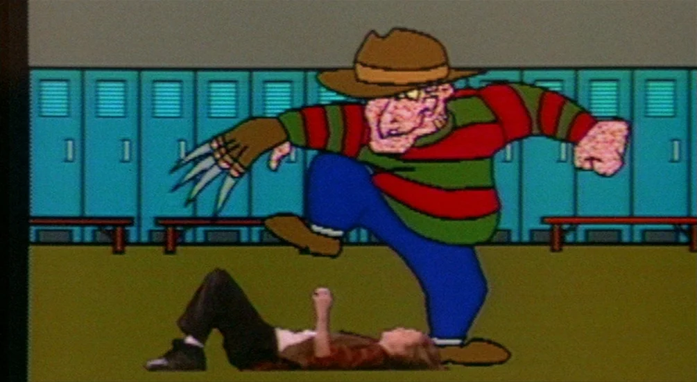 Freddy’s Dead: The Final Nightmare (1991) movie still: medium — A cartoon figure stands over a prone human in a locker room setting. The scene uses…