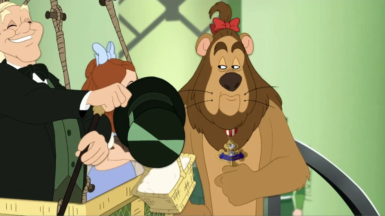 Tom and Jerry & The Wizard of Oz (2011) movie still: medium — A cartoon hot air balloon basket holds a man in a tuxedo and a lion. The man tilts his…