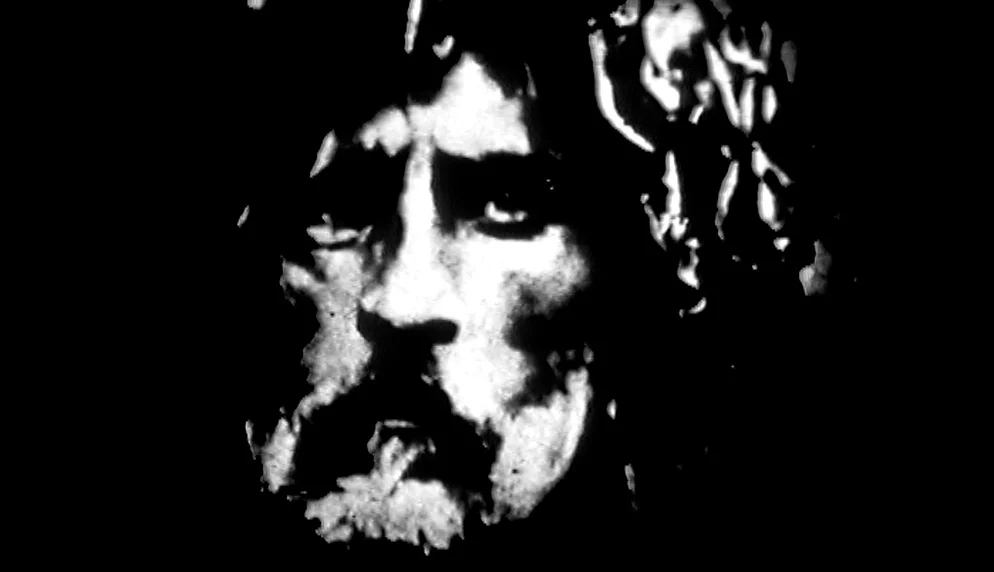 The Plea (1968) movie still: closeup — A high-contrast black and white close-up image of a man's face. The man maintains a steady gaze toward the…
