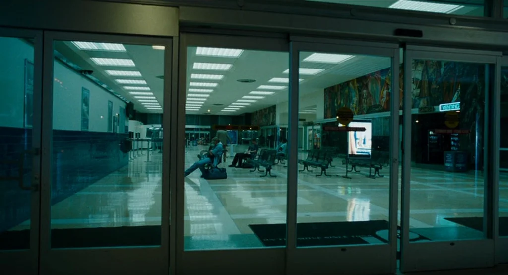 Bad Lieutenant: Port Of Call New Orleans (2009) movie still: wide — An empty, sterile airport terminal features glossy tiled floors and rows of…