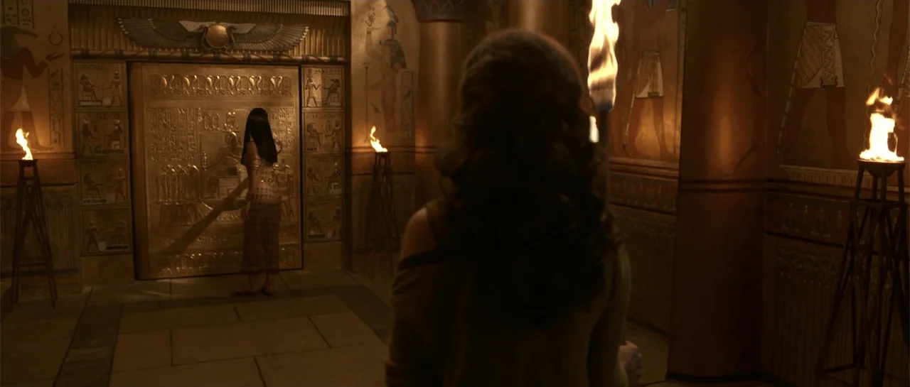 The Mummy Returns (2001) movie still: medium — An ancient Egyptian chamber contains stone walls decorated with hieroglyphic carvings and lit by…