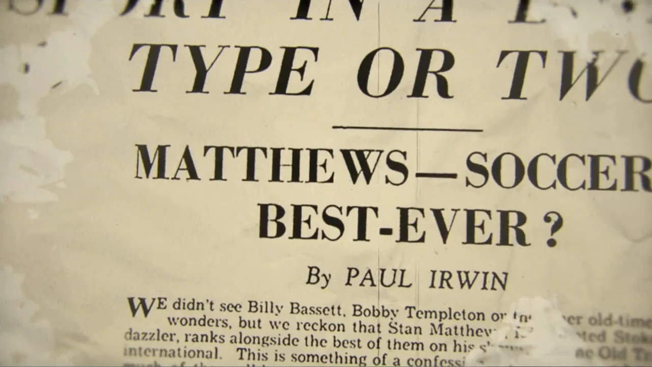 Matthews (2017) movie still: closeup — A close-up view shows a weathered newspaper page with bold printed headlines. The text discusses a soccer…