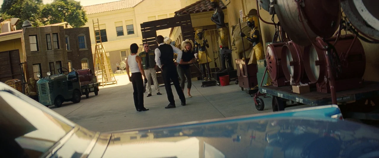 Once Upon a Time… In Hollywood (2019) movie still: wide — A sunny film backlot features various props including Egyptian statues and old studio…
