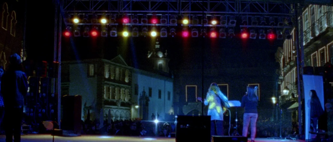 Arabian Nights: Volume 1 – The Restless One (2015) movie still: wide — An outdoor town square at night serves as a venue for a musical performance.…