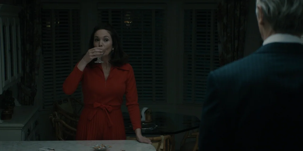 Mark Felt: The Man Who Brought Down the White House (2017) movie still: medium — A dimly lit dining room features closed wooden shutters against the…