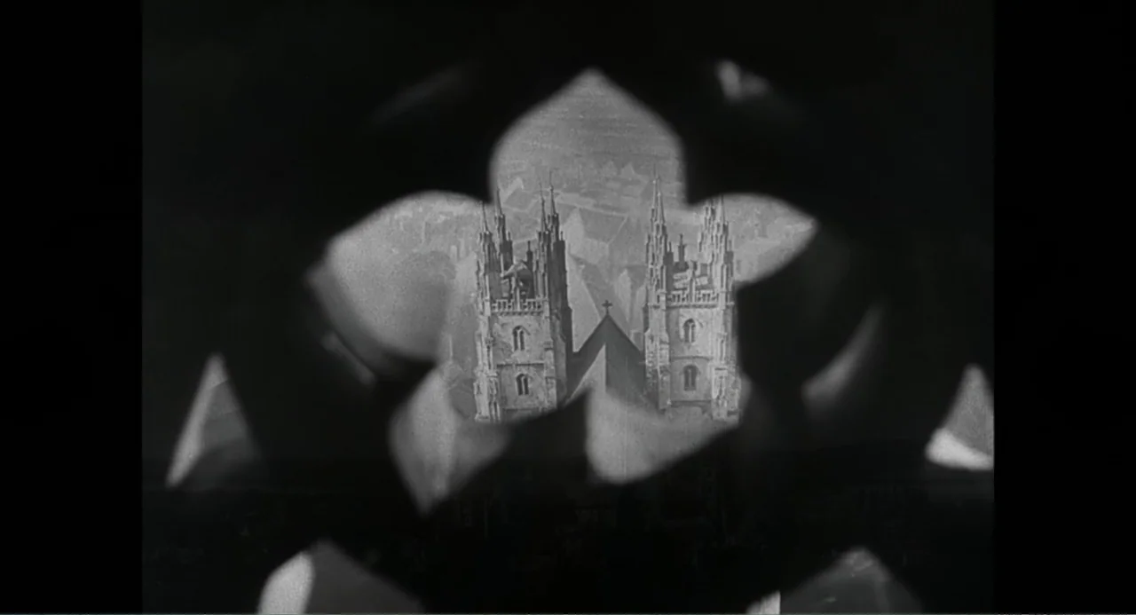 Made in England: The Films of Powell and Pressburger (2024) movie still: establishing — An exterior view of a Gothic cathedral's twin towers framed…