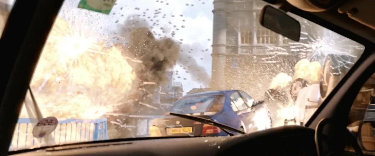 Spider-Man: Far From Home (2019) movie still: medium — A urban street shows a large explosion with smoke and debris filling the air. A blue sedan…