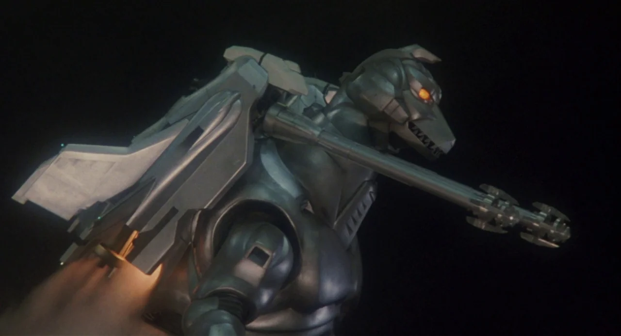 Godzilla vs. Mechagodzilla II (1993) movie still: medium — A giant mechanical monster glides through a vast void of pitch black darkness. The figure…