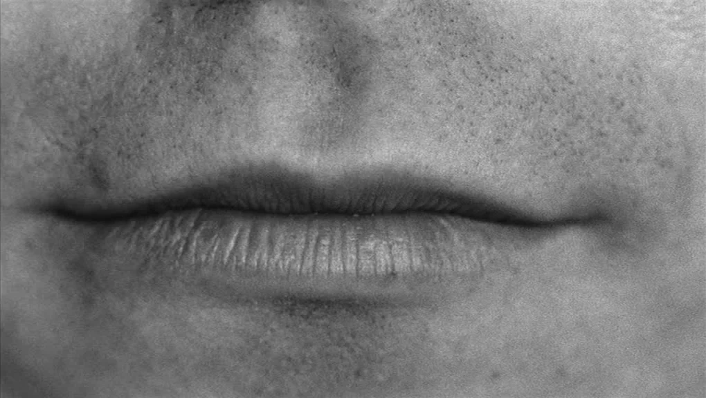 Who’s That Knocking At My Door (1967) movie still: closeup — An extreme close-up of a human mouth and the area immediately above it. The skin…