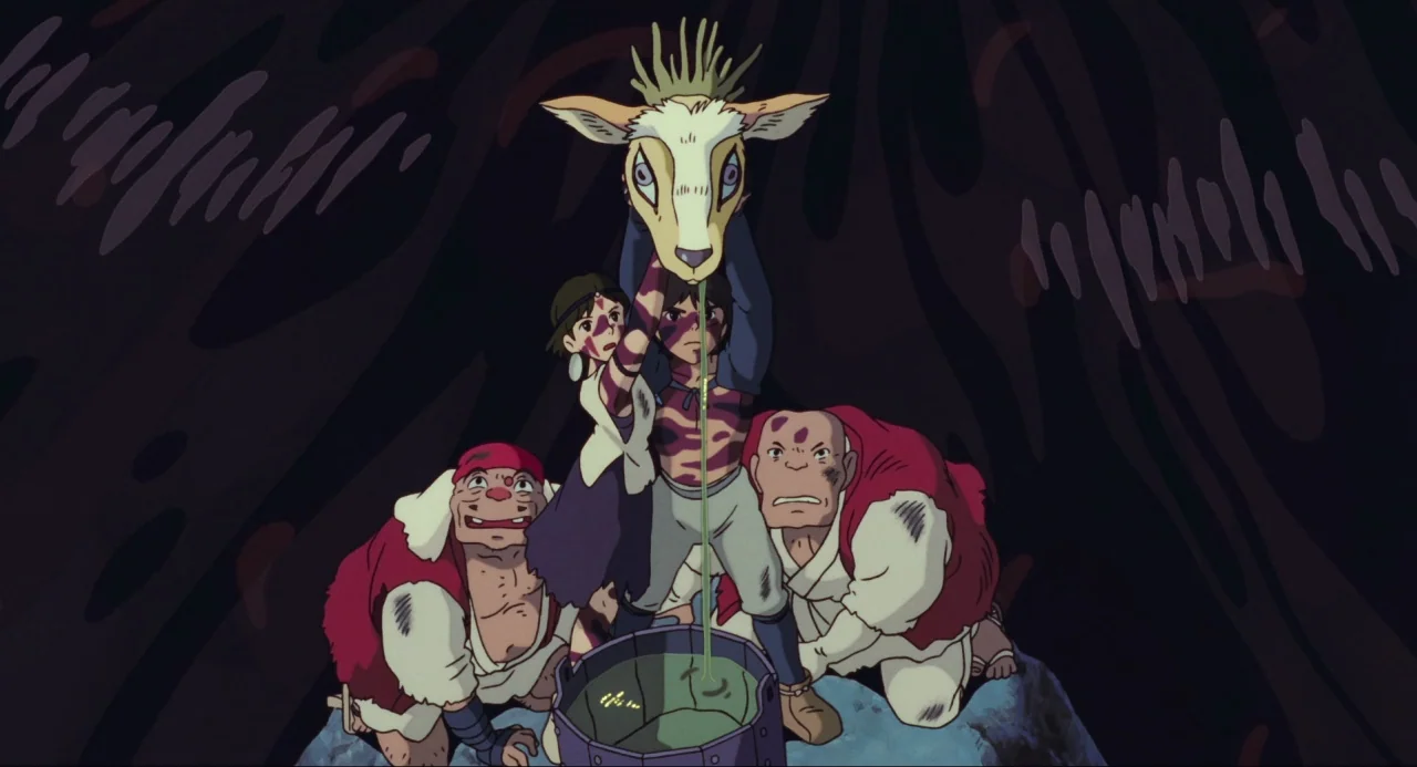 Princess Mononoke (1997) movie still: medium — A dark, cavernous space with shadowy organic walls surrounding a small group of figures. Four people…