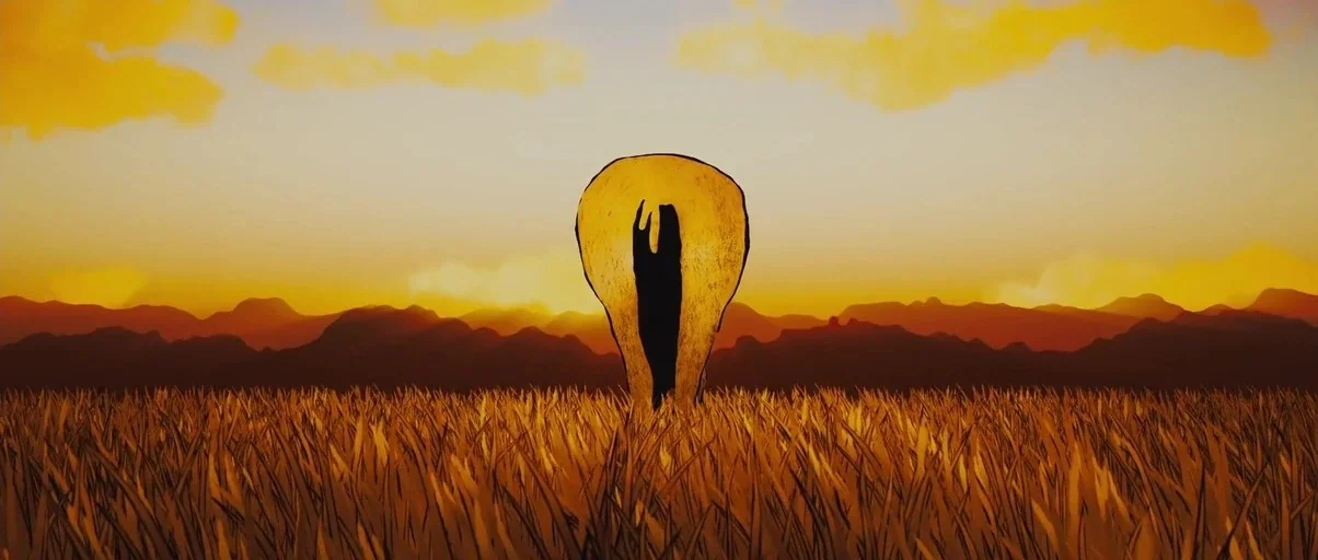 True Grit (2010) movie still: wide — An expanse of dry grass is set against a backdrop of distant, layered mountain silhouettes. A single large…
