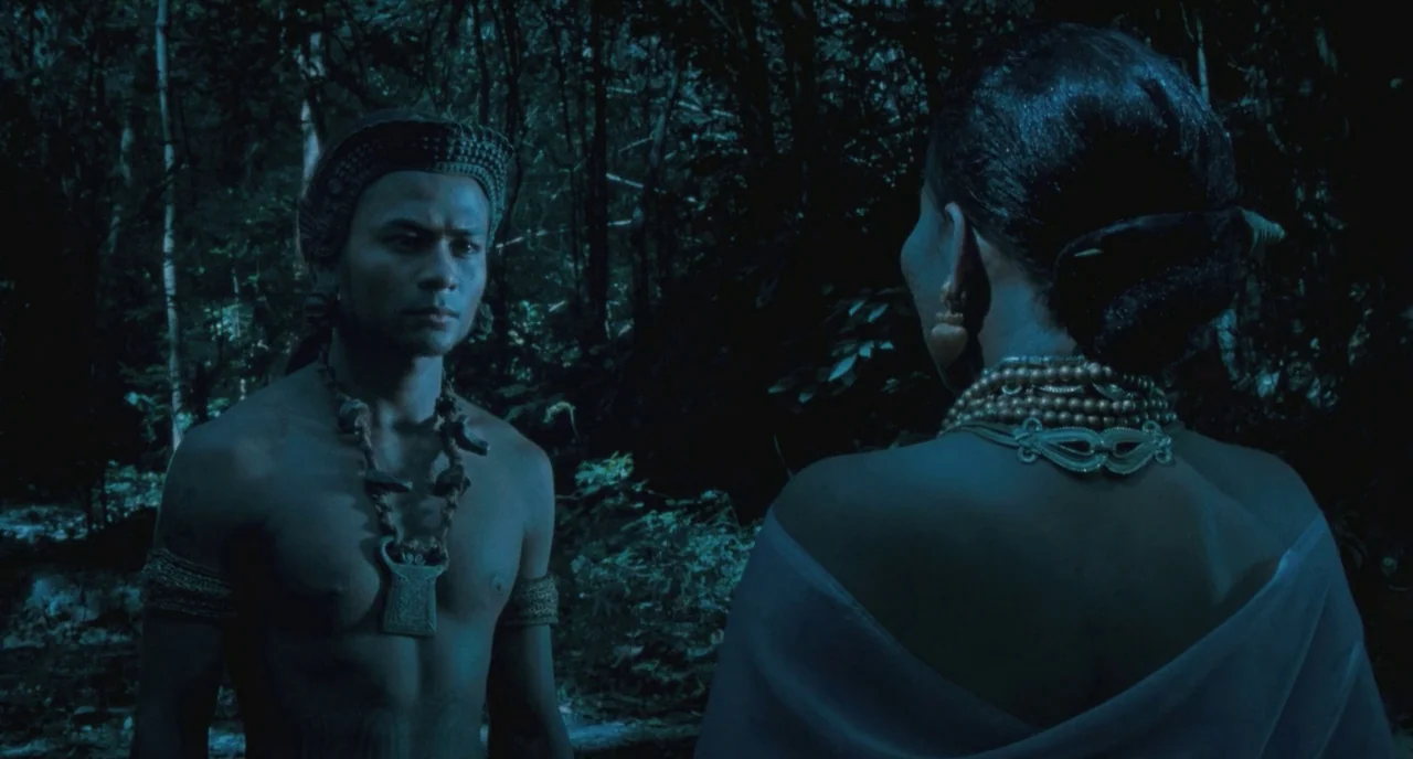 Uncle Boonme Who Can Recall His Past Lives (2010) movie still: medium — A dark, densely vegetated jungle at night with tall trees and dense shadows.…