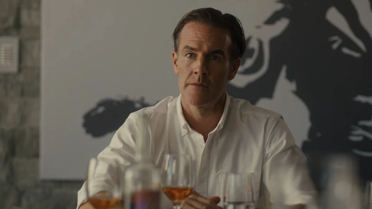 Sidelined: The QB and Me (2025) movie still: medium — A modern indoor room features a stone-textured wall and a prominent black and white graphic. A…