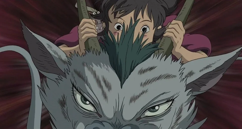 Spirited Away (2001) movie still: medium — A young girl grips the horns of a large furry grey mythical creature. Radial speed lines background…