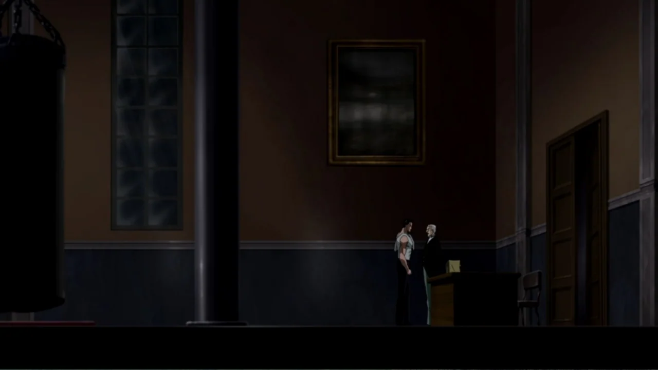 Batman: Gotham Knight (2008) movie still: wide — A dimly lit room with tall windows, a single dark pillar, and framed art. A young man wearing a…
