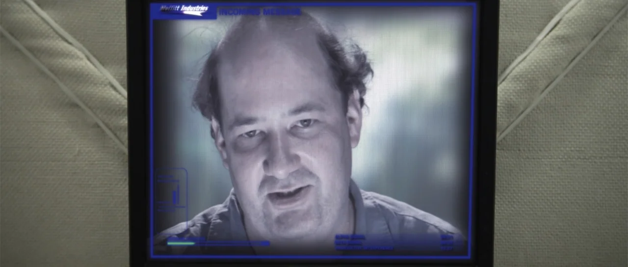 Astronaut: The Last Push (2012) movie still: closeup — A computer screen displays a digital video call with a message header. The man appears in the…