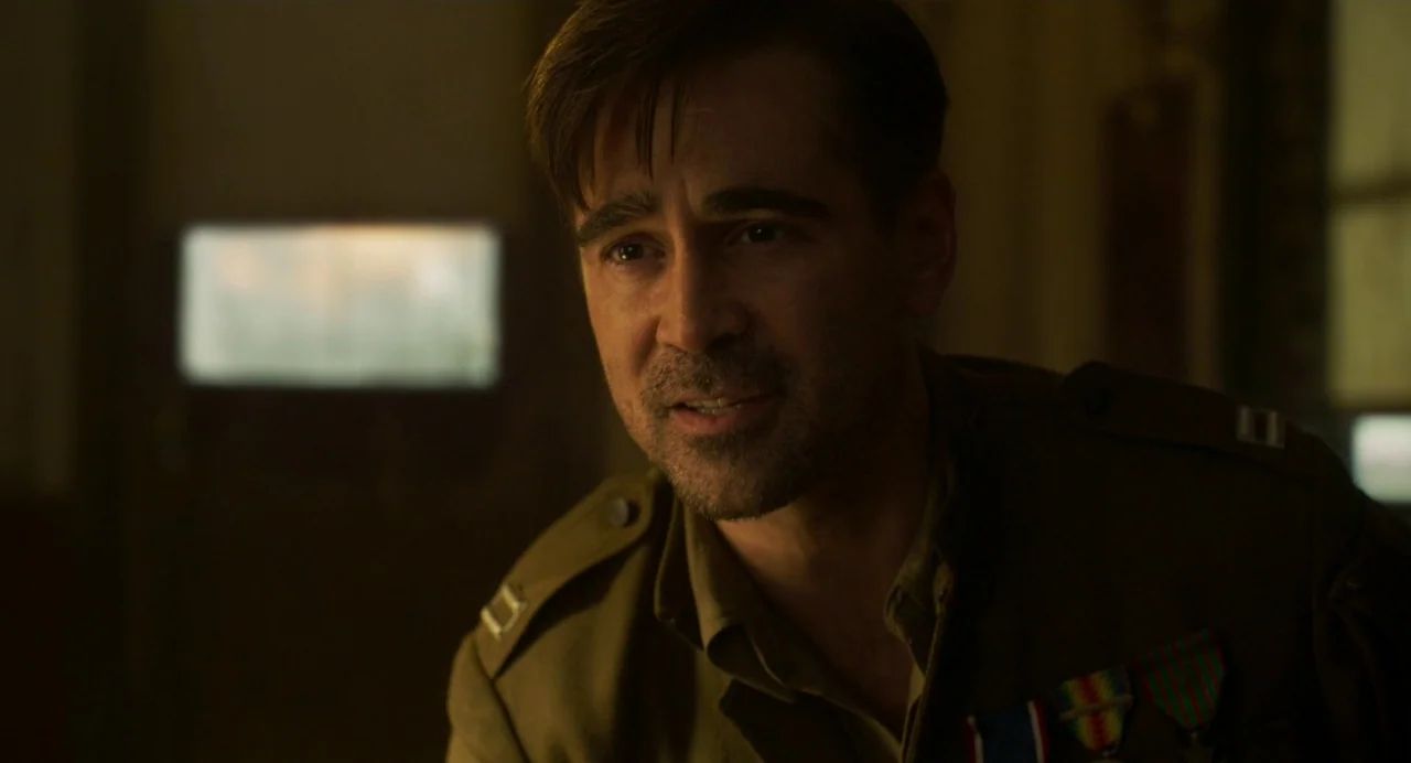 Dumbo (2019) movie still: closeup — A dimly lit room with soft ambient light filtering through a window. A man in a military uniform speaks while…