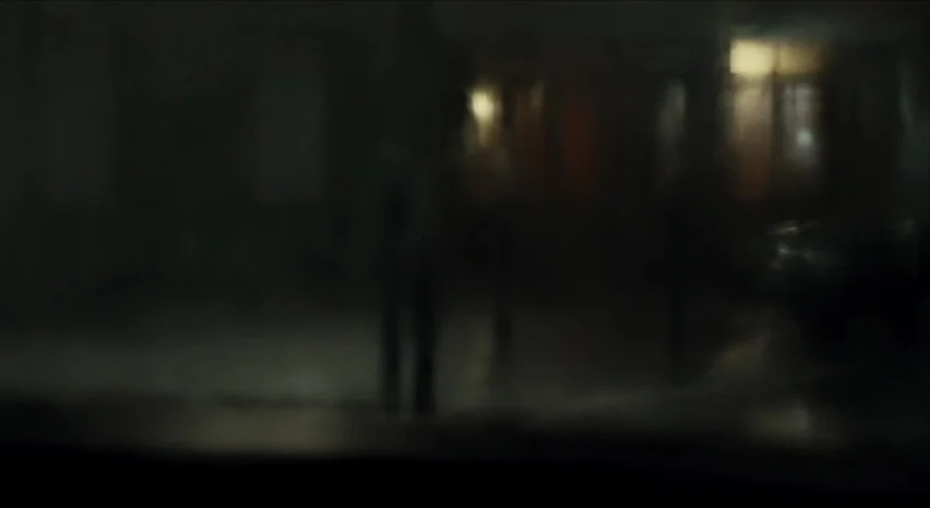 35 Shots of Rum (2008) movie still: wide — An extremely out-of-focus, dark nighttime scene displays indistinct shapes of buildings or structures.…