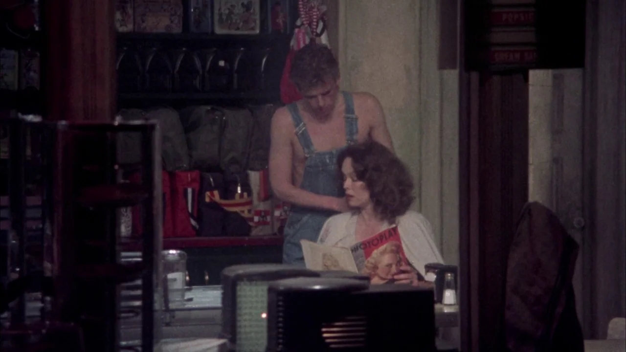 Come Back to the 5 & Dime Jimmy Dean, Jimmy Dean (1982) movie still: medium — A dimly lit, vintage-style diner booth contains shelves filled with…