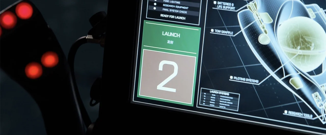 The Meg (2018) movie still: closeup — A high-tech digital control screen displays a launch sequence with various technical schematics. The interface…