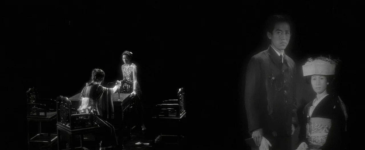 Story of a Prostitute (1965) movie still: wide — A surreal stage set features two distinct focal points against an endless black void. To the left…