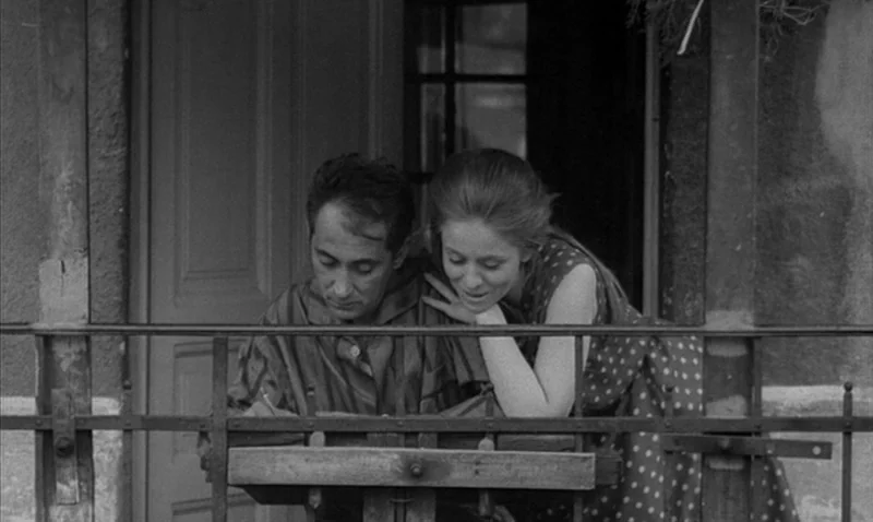 Love Affair, or the Case of the Missing Switchboard Operator (1967) movie still: medium — A man and a woman stand together on an outdoor balcony…