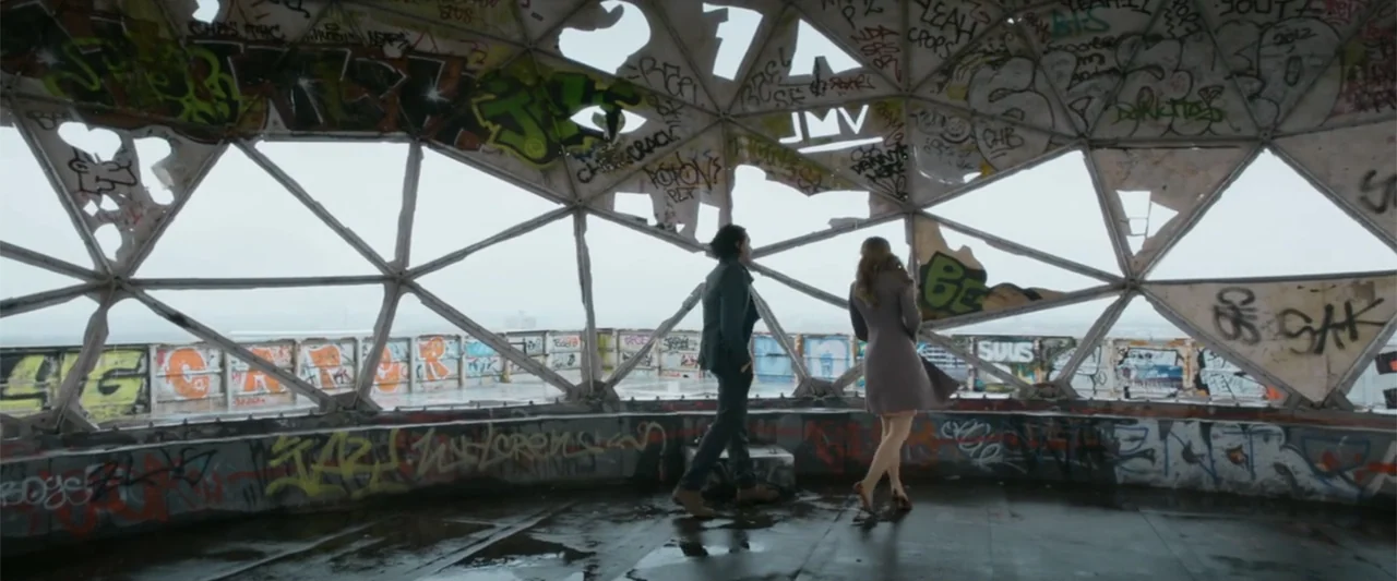 Heartburn (1986) movie still: wide — A damaged geodesic dome features extensive graffiti and large open gaps in the framework. A man and a woman…