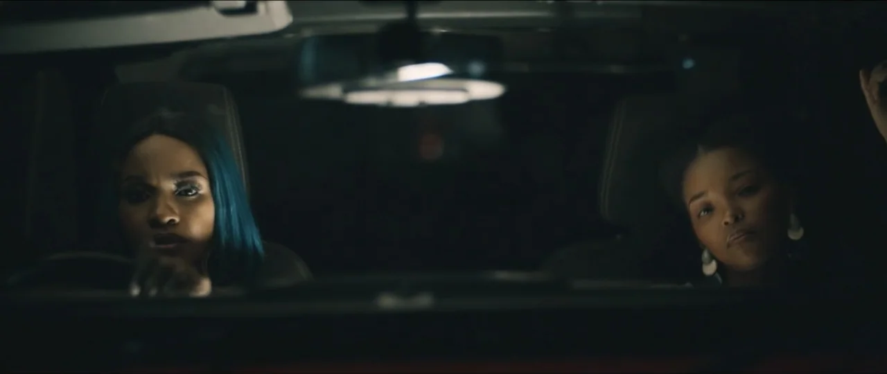 My Girlfriend's Father (2023) movie still: medium — A dark, modern car interior at night with two women occupying the front seats. The two women…