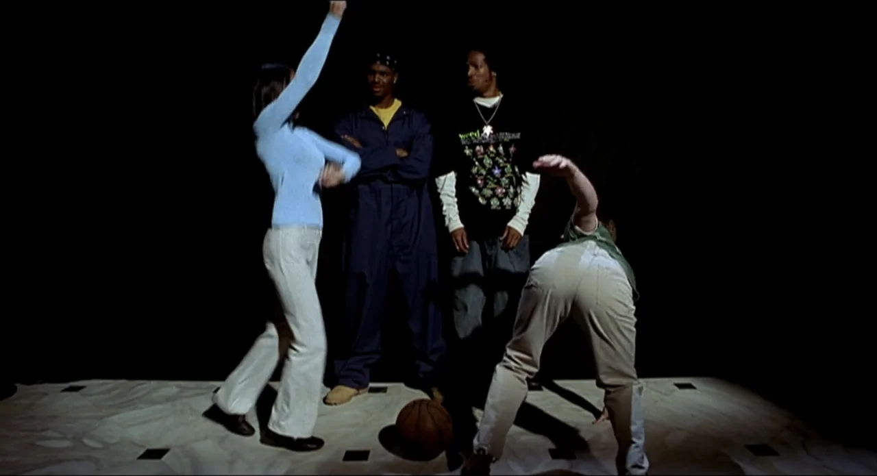 Scary Movie 2 (2001) movie still: fullbody — A dark, empty space with a lit marble floor featuring square black inlays. Four young adults stand…