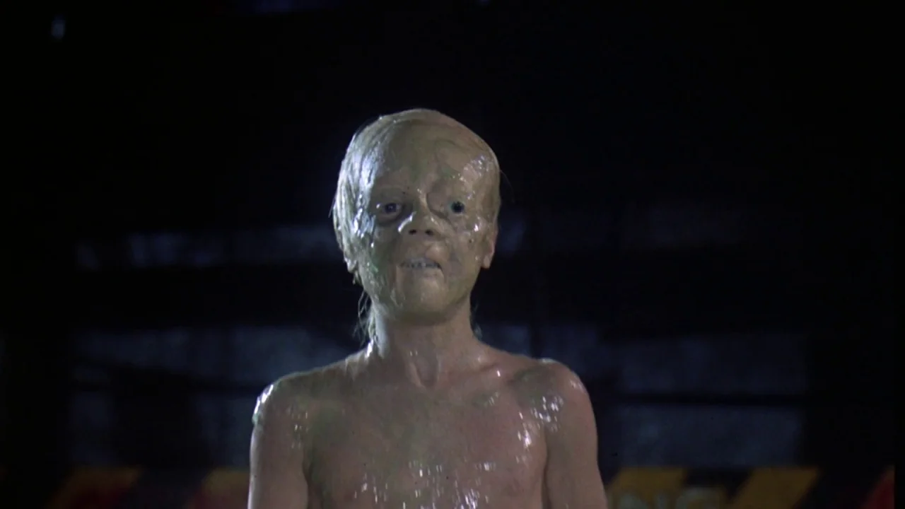 Friday the 13th Part VIII: Jason Takes Manhattan (1989) movie still: medium — A dark, unidentifiable space serves as the backdrop for a central…