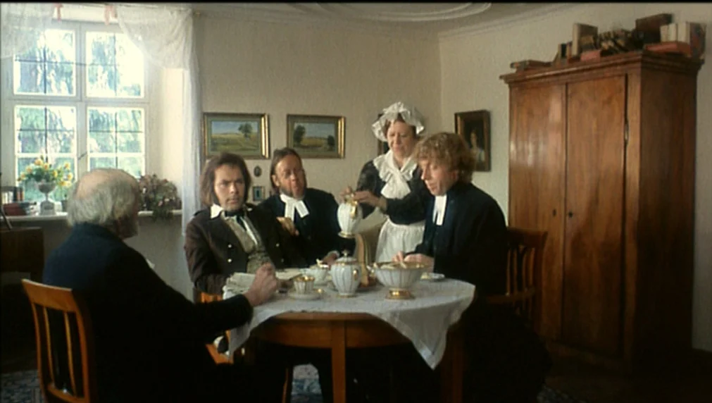 The Enigma Of Kaspar Hauser (1974) movie still: medium — A 19th-century dining room features white walls, framed oil paintings, and a large wooden…