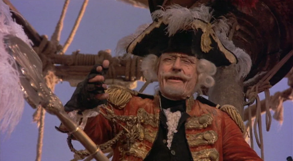 The Adventures Of Baron Munchausen (1988) movie still: medium — The deck of a historical sailing ship is visible with rigging in the background. An…