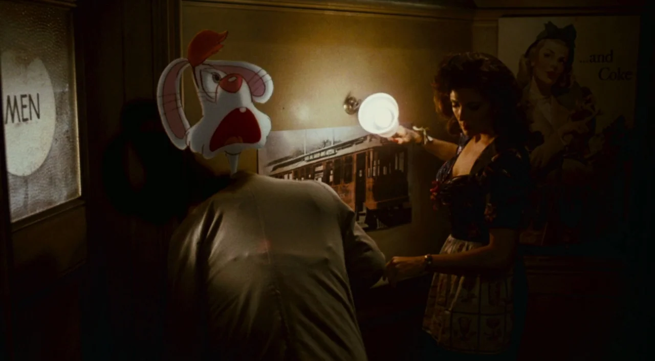 Who Framed Roger Rabbit (1988) movie still: medium — A dimly lit room with yellow walls and a vintage poster featuring a trolley. A cartoon rabbit…
