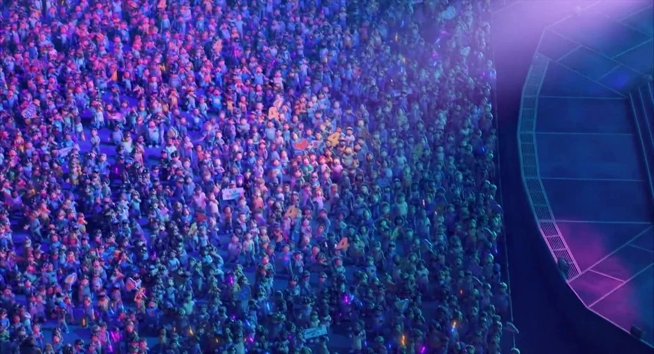 Turning Red (2022) movie still: wide — A vast crowd fills the lower seating area of a large, dark concert arena. Hundreds of stylized animated…