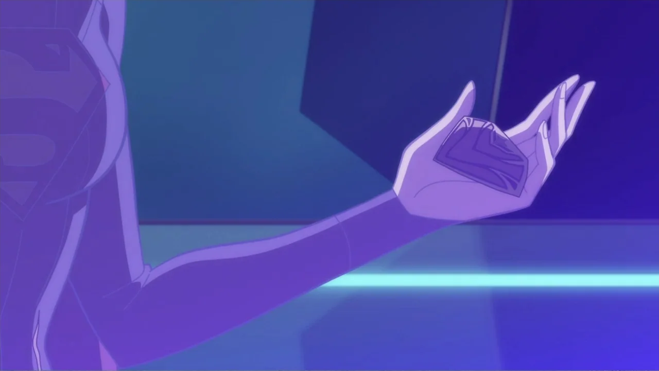 Legion of Super-Heroes (2023) movie still: closeup — A stylized interior space with a flat purple surface and geometric wall panels. A hand wearing…