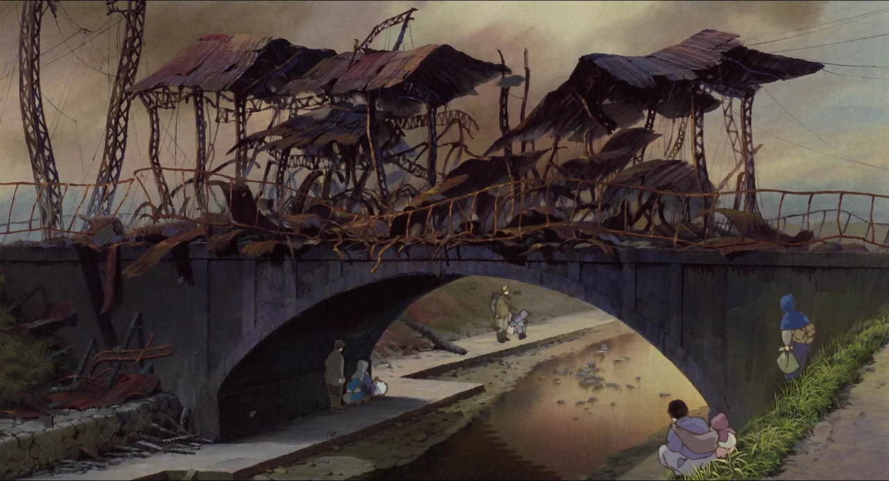 Grave of the Fireflies (1988) movie still: wide — A stone bridge with rusted metal wreckage sits over a calm, murky canal. Several small figures in…