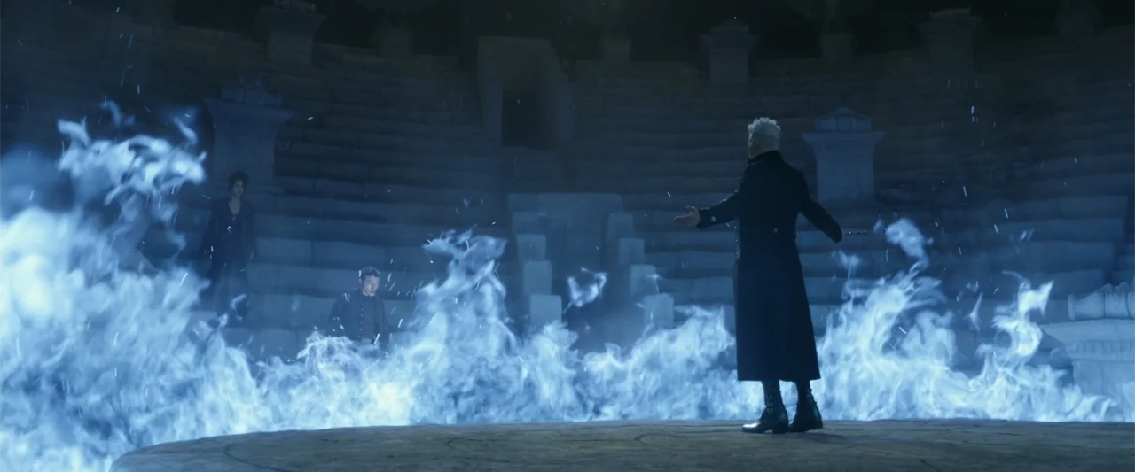 Fantastic Beasts: The Crimes of Grindelwald (2018) movie still: wide — A large stone amphitheater is filled with dark shadows and tiered circular…