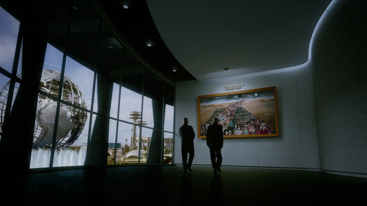 Big Eyes (2014) movie still: wide — A spacious, modern gallery room features a massive window overlooking a spherical metal structure. Two men in…